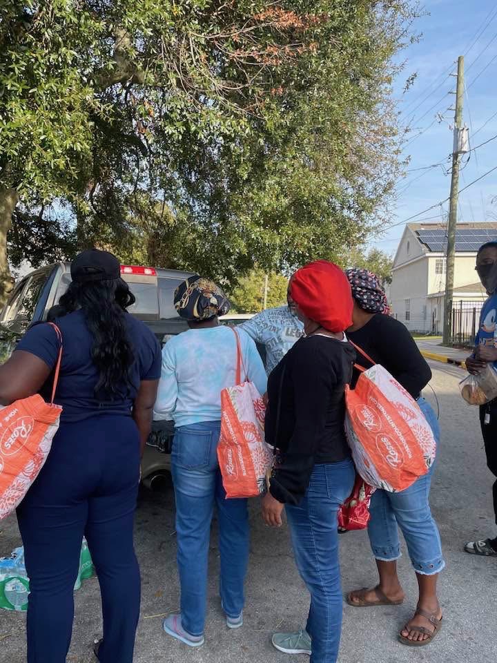 Community gathering to receive groceries and supplies