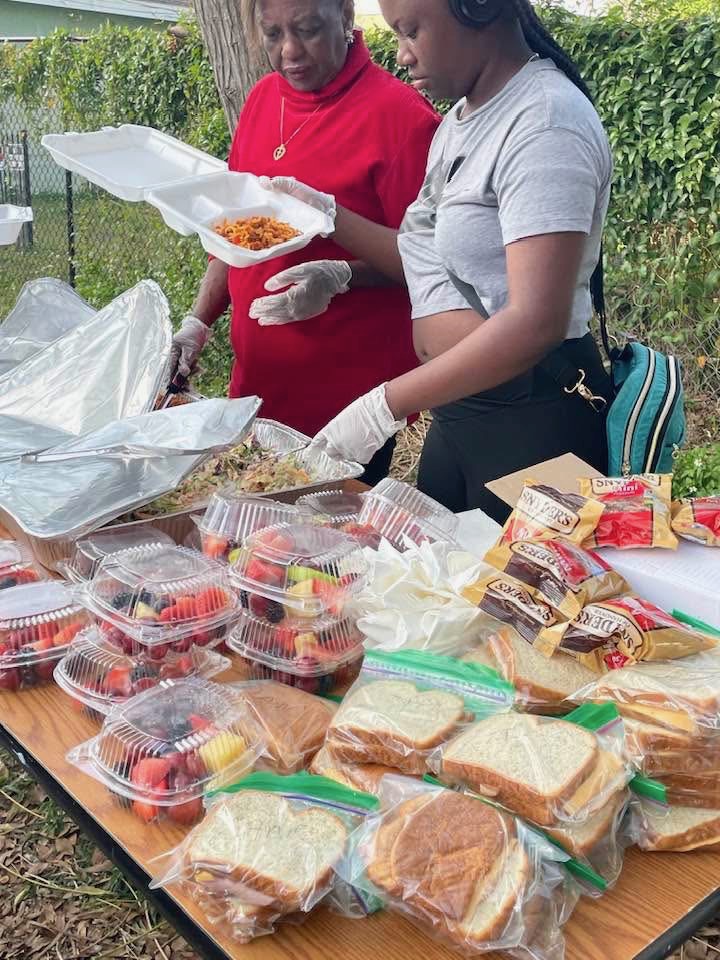 Volunteers serving meals to the community